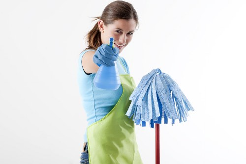 Professional upholstery cleaning of a fabric sofa in a living room