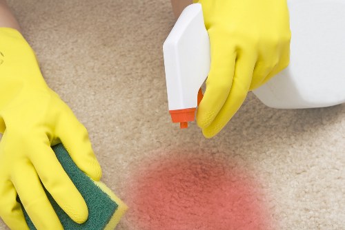 Vacuuming a mattress surface during cleaning